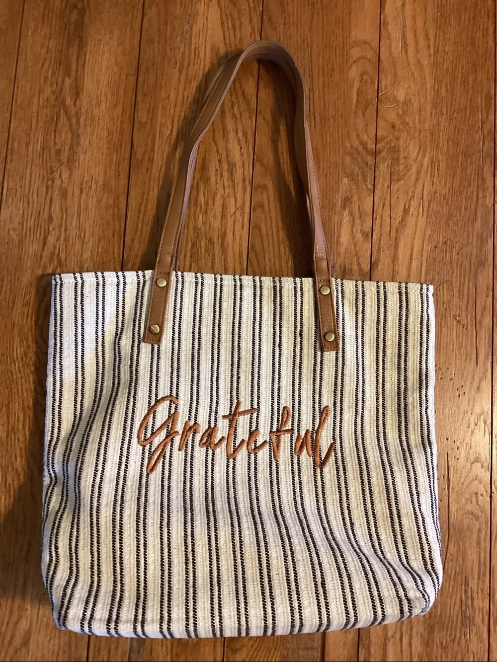 “Grateful” blue and white striped tote bag with tan straps